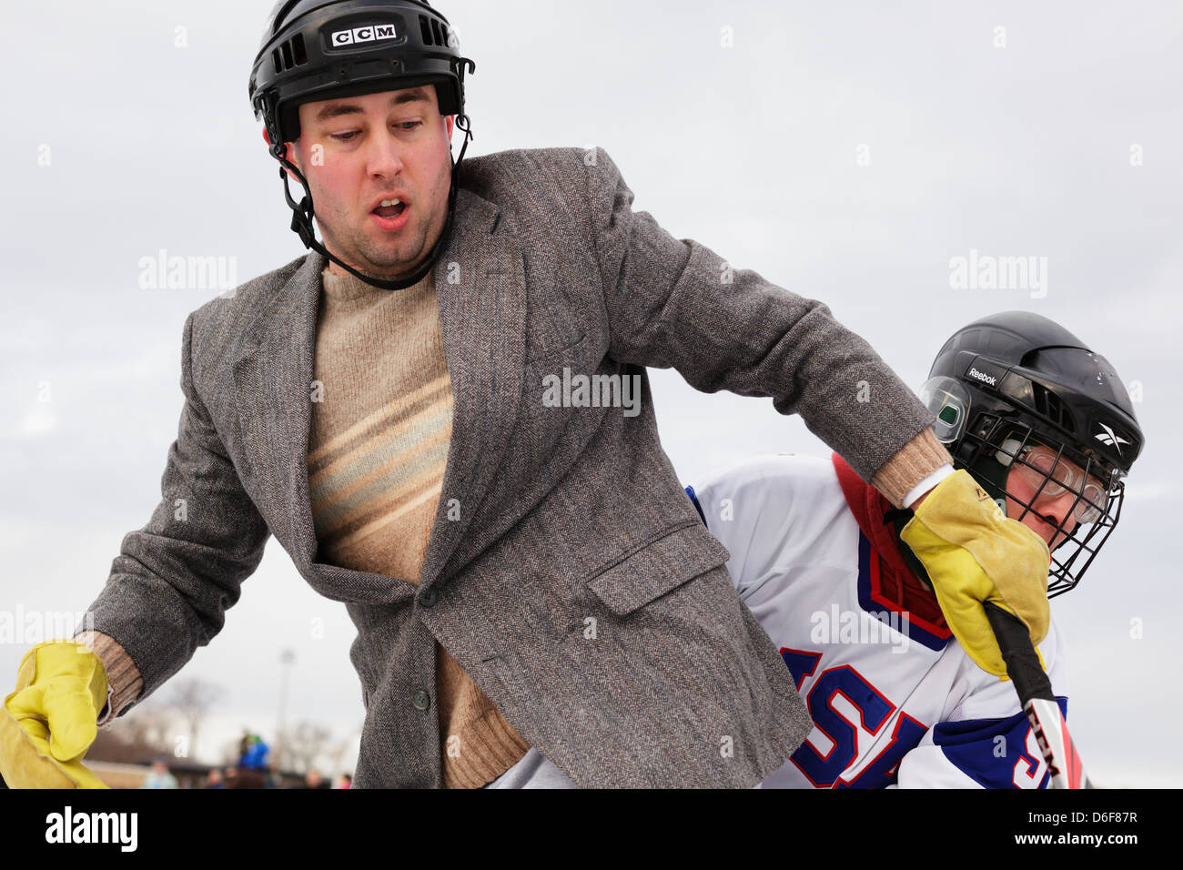 Competitors battle during a game at the U.S. Pond Hockey Championships on Lake Nokomis on January 19, 2013 in Minneapolis, Minne Stock Photo
