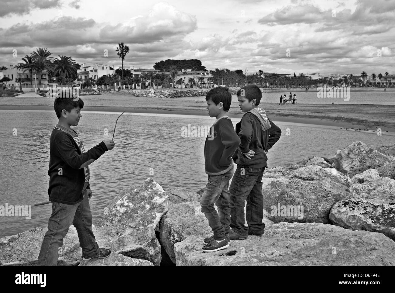 -Fellowship- Kids playing in Outdoors. Mediterranean Sea (Spain). Stock Photo