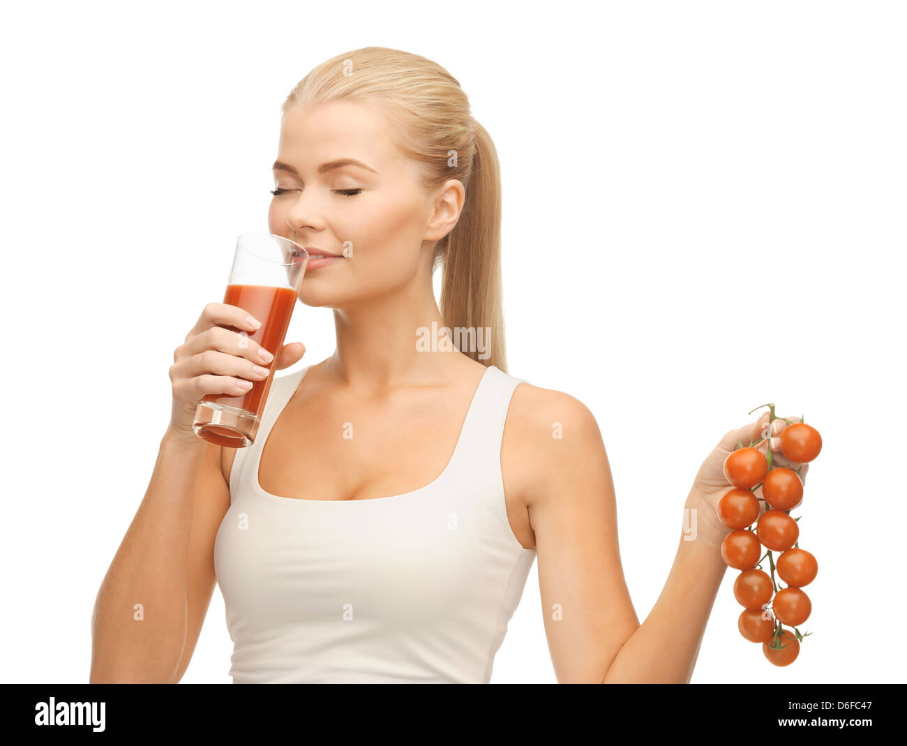 woman drinking tomato juice Stock Photo