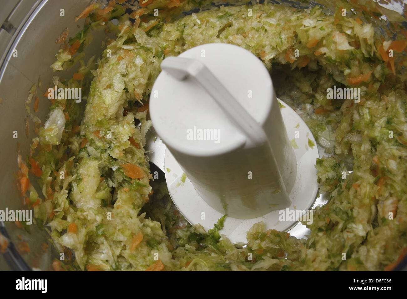 lettuce and carrot chopped up in a food blender Stock Photo Alamy