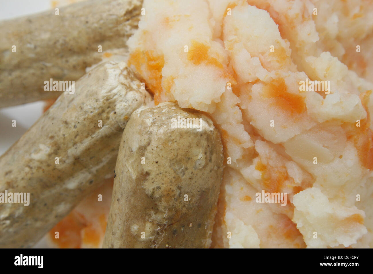 quorn sausages, carrot and potato mash on white plate Stock Photo Alamy