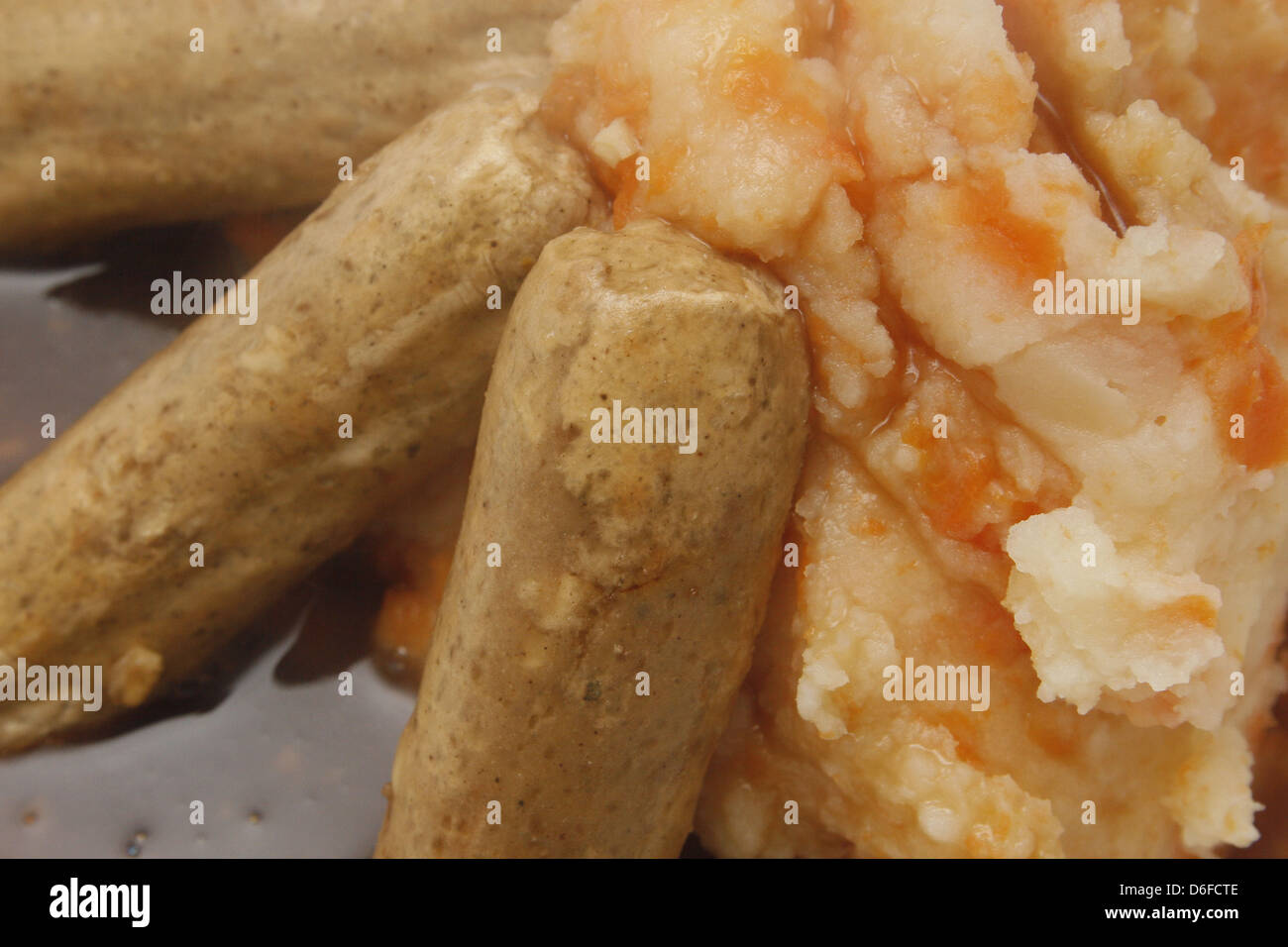 quorn sausages, carrot and potato mash smothered in gravy Stock Photo