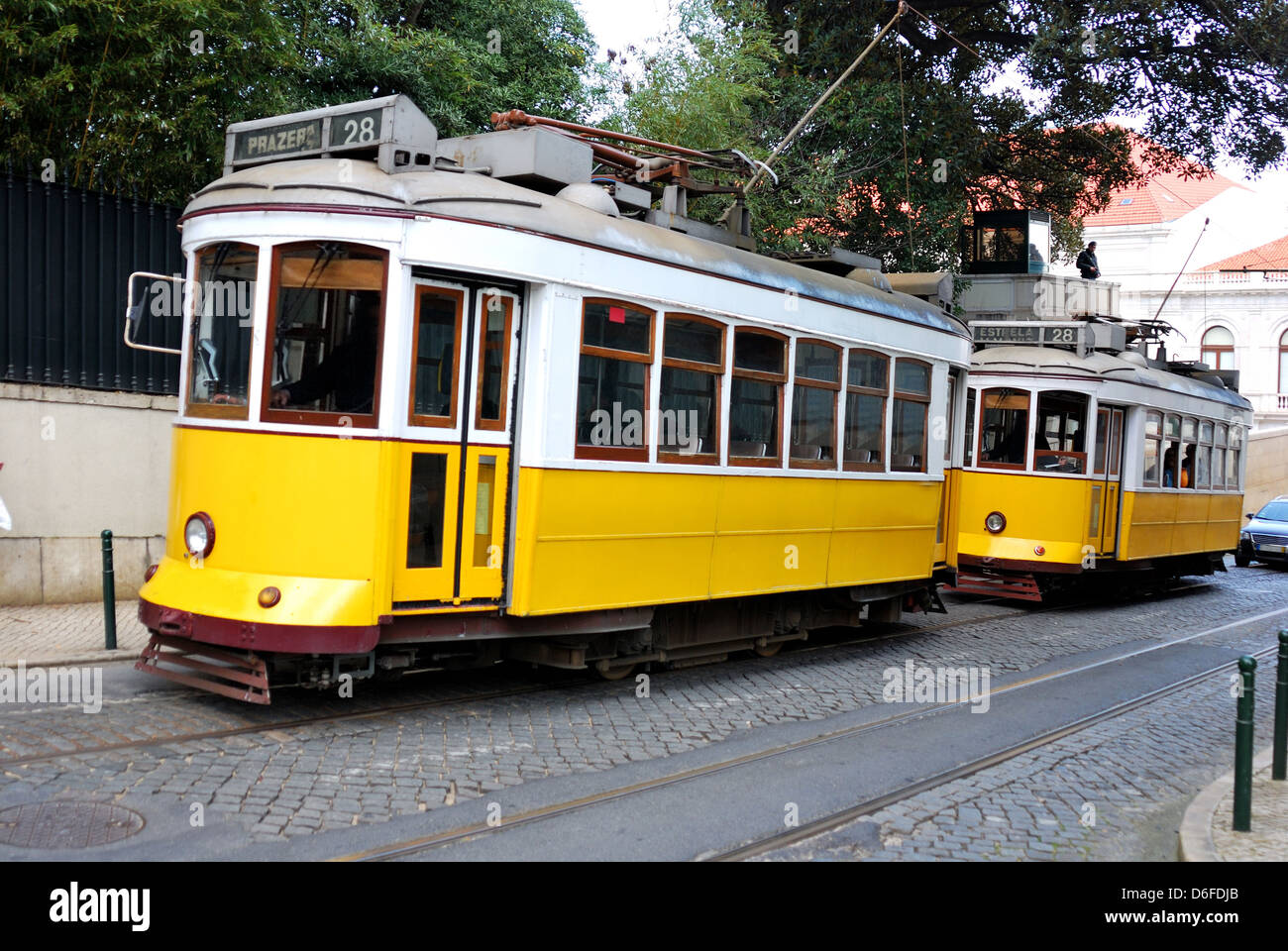These distinctive yellow trams are one of the tourist icons of modern Lisbon Stock Photo