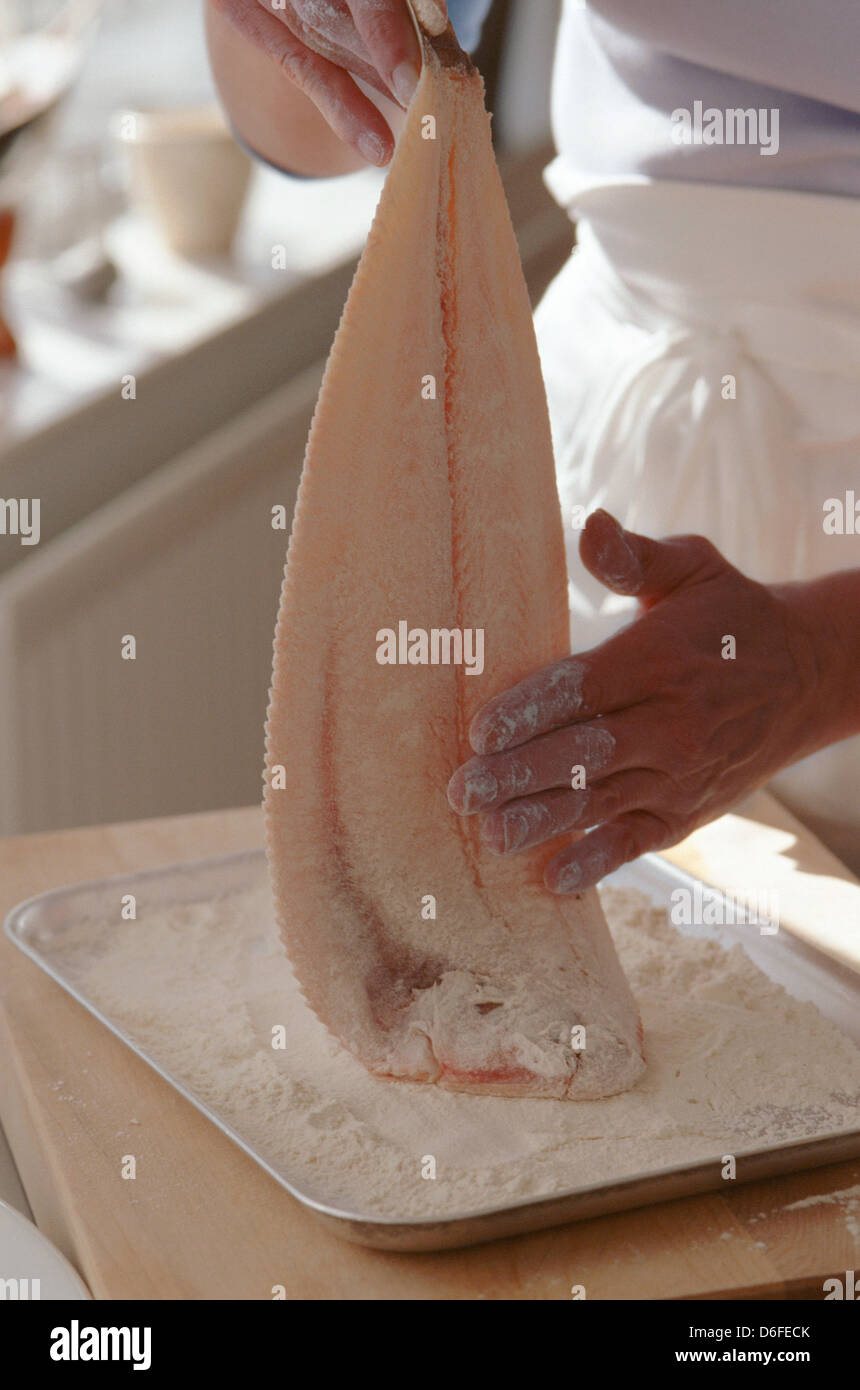 Dipping Dover Sole in Flour Stock Photo
