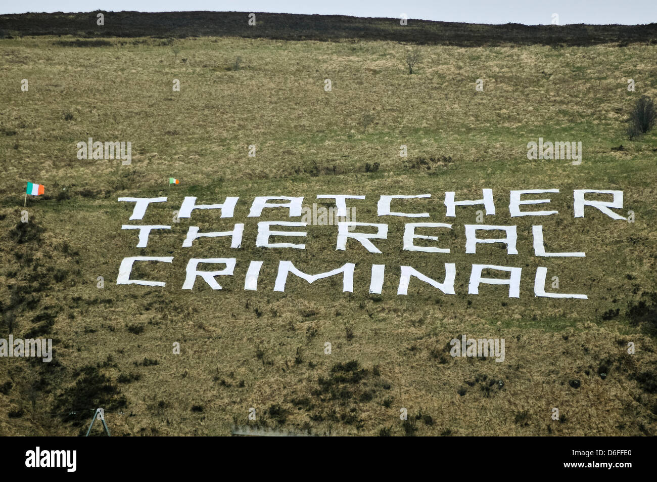Belfast, Northern Ireland.  17th April, 2013. A giant message reading 'Thatcher The Real Criminal' has been left on Black Mountain above Belfast.  The sign is visible for miles around the city. Stock Photo