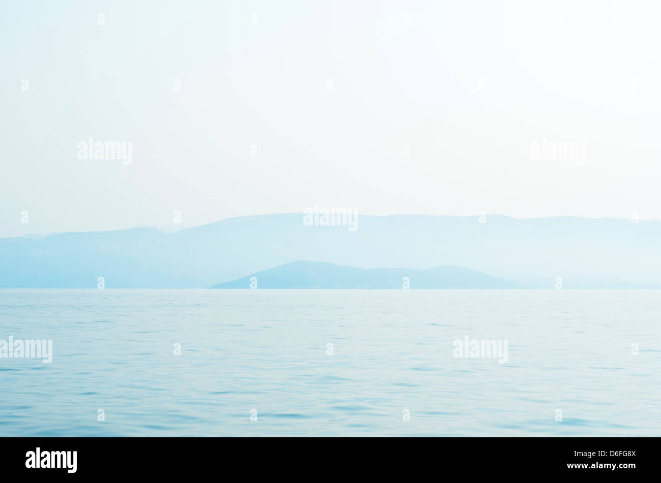 A photograph of an island seen from the coast of Kavos, Greece. Stock Photo