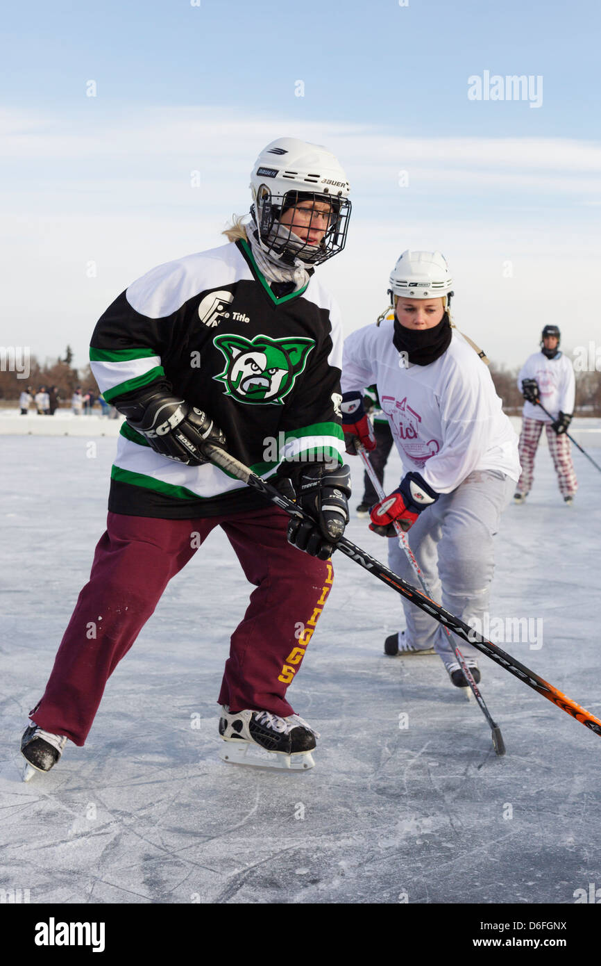Players compete in a game at the U.S. Pond Hockey Championships on Lake