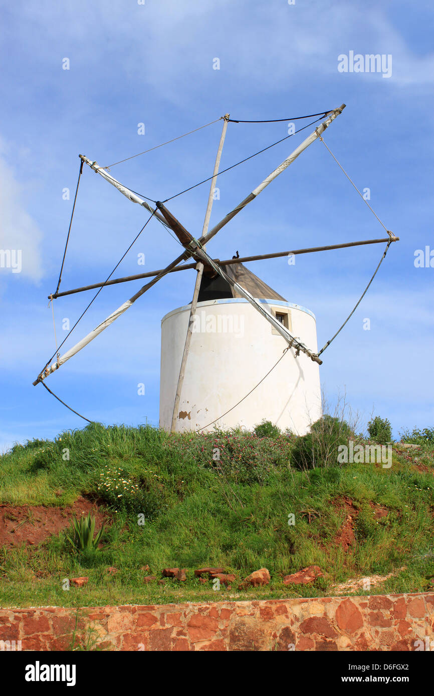 An old rundown windmill with no sails in Algarve, Portugal, Europe Stock Photo