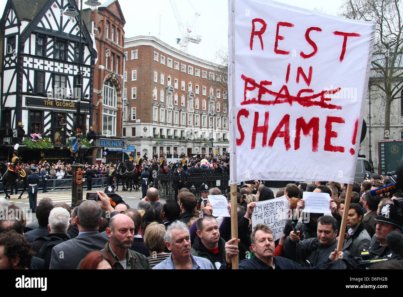 London, UK. 17th April 2013. The Funeral of Baroness Margaret Thatcher. An anti-Thatcher protester with a Rest in Shame placard outside the Royal Courts of Justice. The Funeral service takes place in St. Paul's Cathedral, London. Pic: Paul Marriott Photography/Alamy Live News Stock Photo