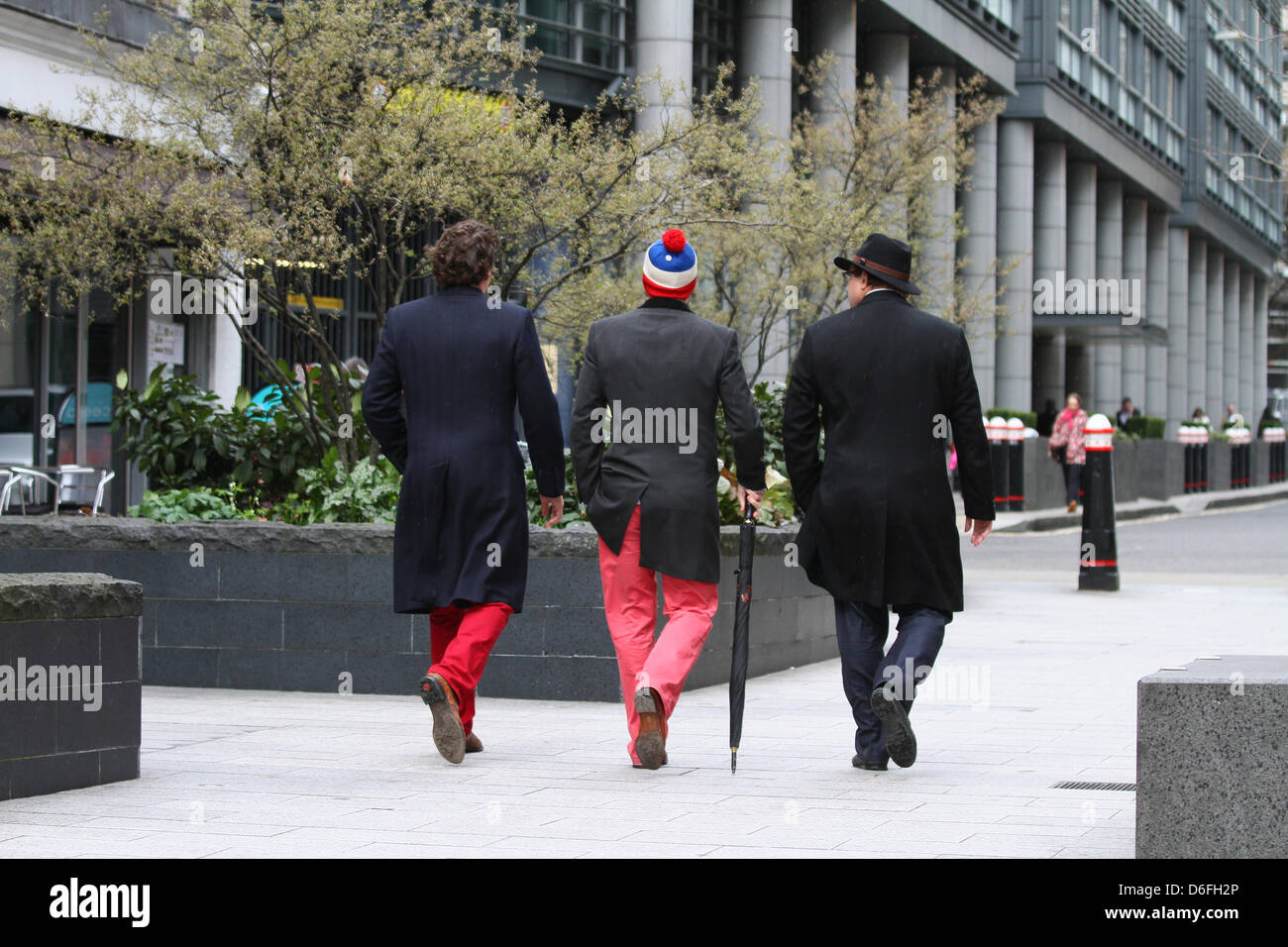 London, UK. 17th April 2013. The Funeral of Baroness Margaret Thatcher. Three gentlemen walk away from Ludgate Circus. The Funeral service takes place in St. Paul's Cathedral, London. Pic: Paul Marriott Photography/Alamy Live News Stock Photo