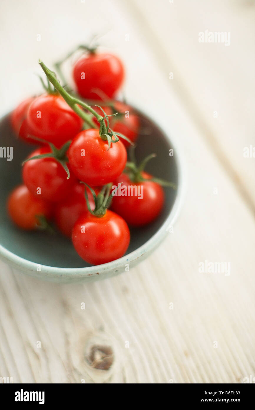 Cherry tomatoes in green bowl Stock Photo - Alamy