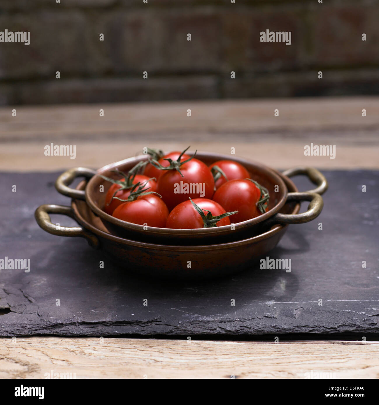 Tomatoes in a Copper Bowl Stock Photo Alamy