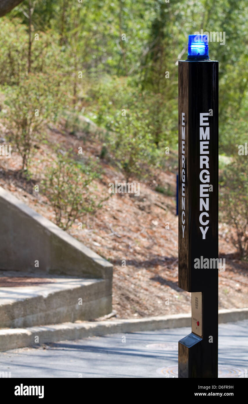 Emergency distress beacon with help call box located in public park. Stock Photo