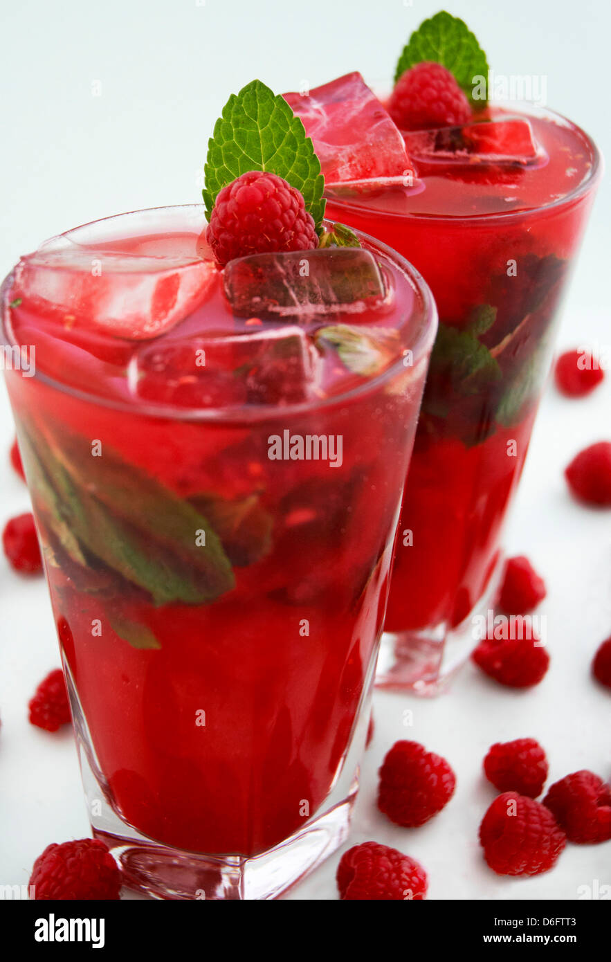 Berry Delicious Cocktail- Bright red long drink with recipe Stock Photo