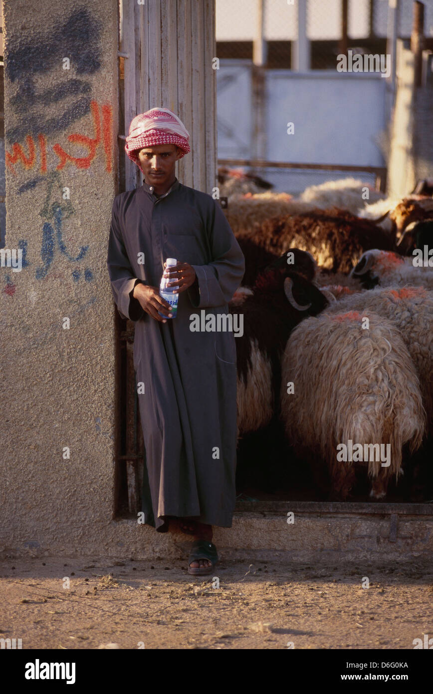 riyadh, saudi arabia -- a third-country laborer slaughterhouse worker on break. Photograph by Barry Iverson Stock Photo