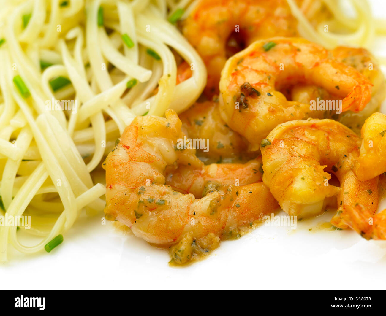 Garlic prawn and linguine with chives - with Recipe Stock Photo - Alamy