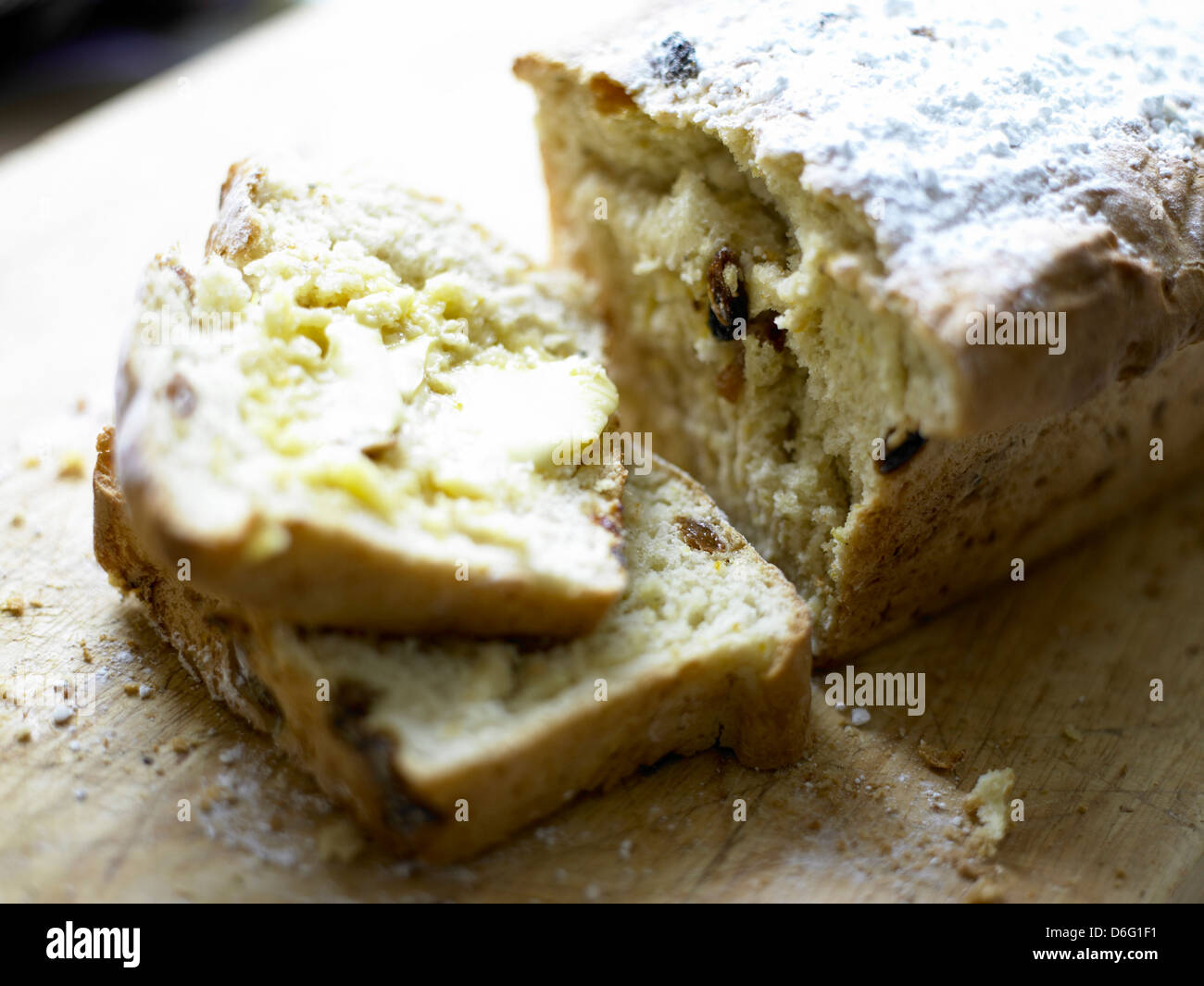 Sliced mixed fruit loaf with butter with recipe Stock Photo Alamy