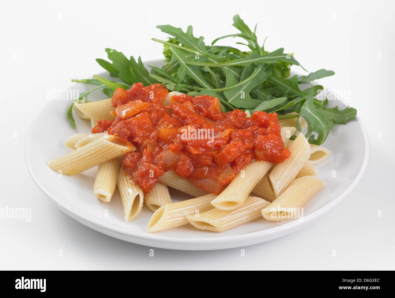 Penne Pasta with tomato sauce and rocket Stock Photo