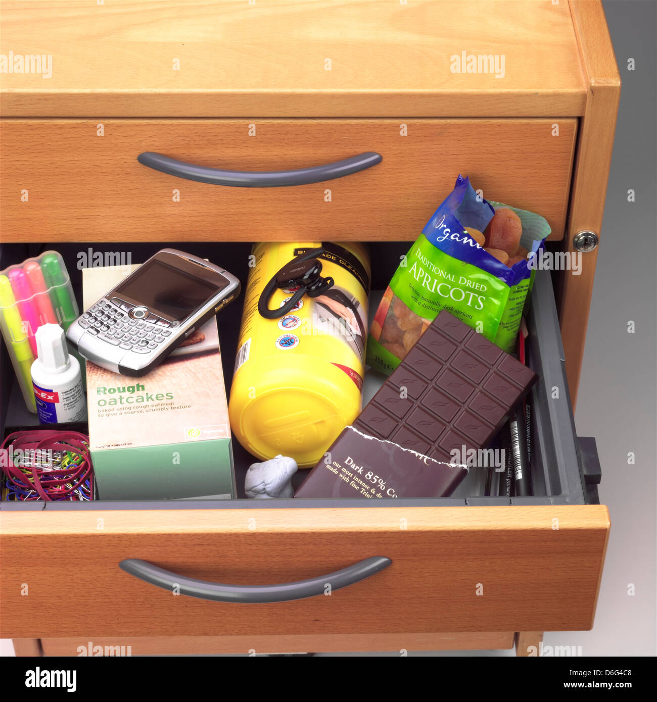 Office desk drawer full of snacks Stock Photo Alamy