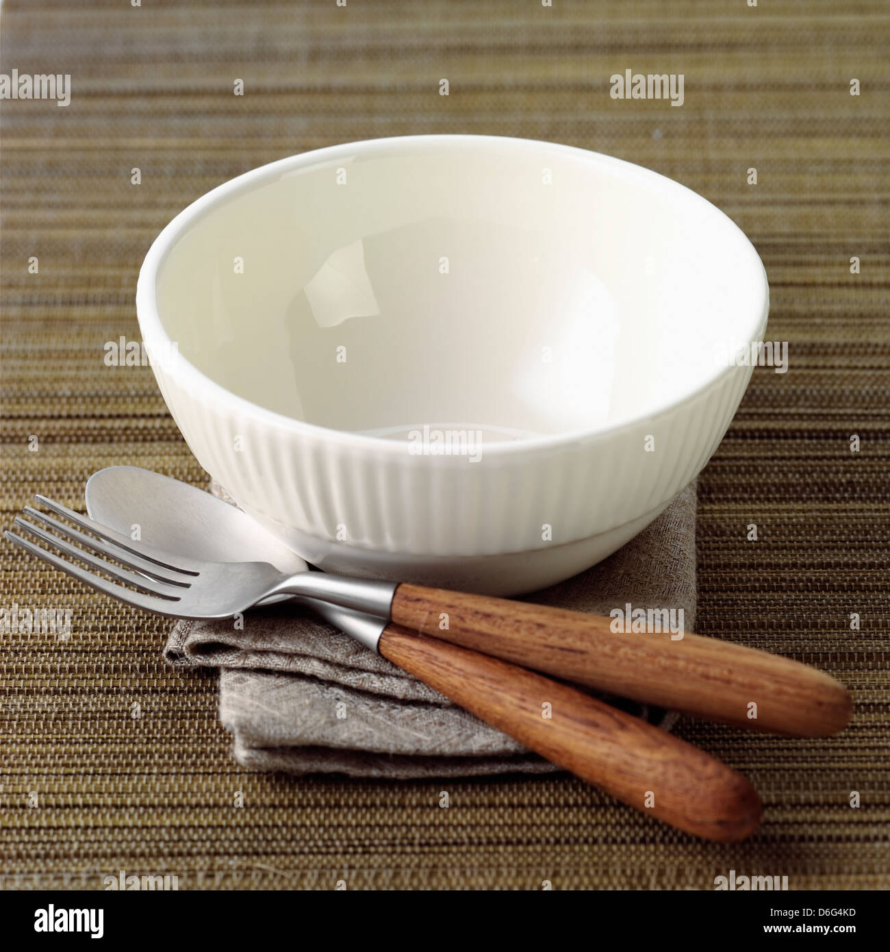 Empty Bowl and place setting Stock Photo
