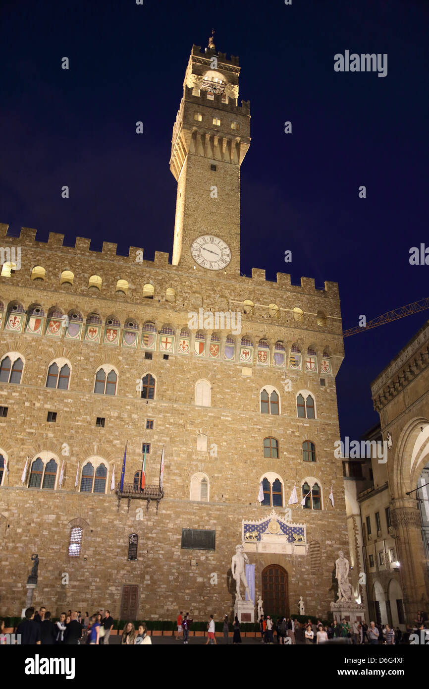 Piazza della Signoria at night in Florence Italy. Palazzo Vecchio and a replica statue of David in the background. Stock Photo