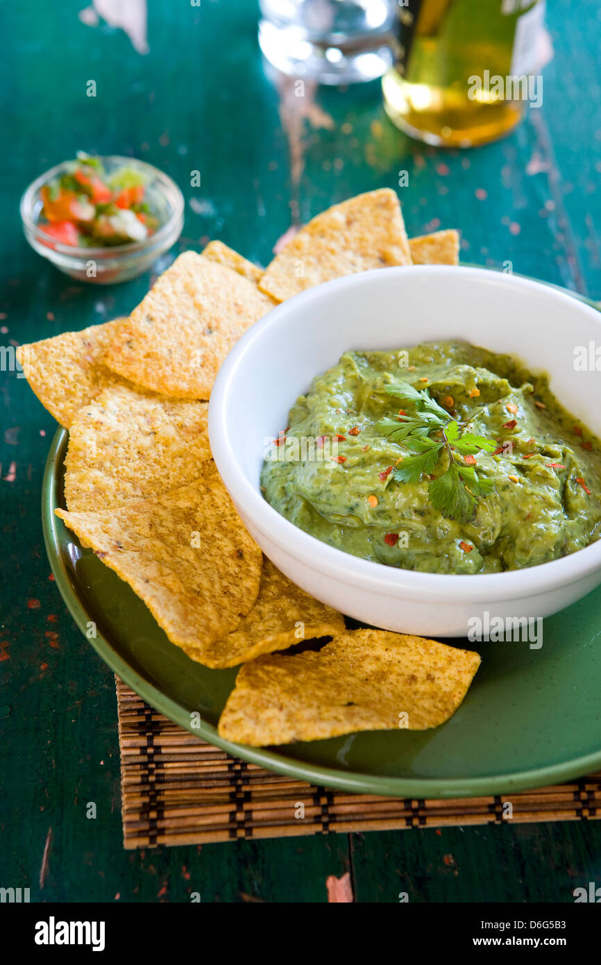 Homemade Guacamole with tortilla chips with recipe Stock Photo Alamy