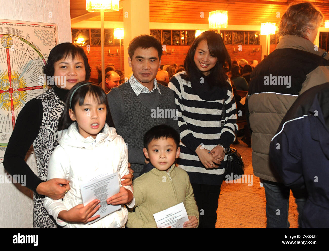 Marries couple Thi Sang and Minh Tuong Nguyen pose at the entrance to ...