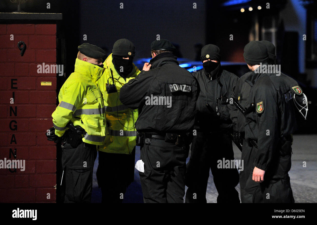 Police officers stand in front of a brothel in Leverkusen, Germany, 09 ...