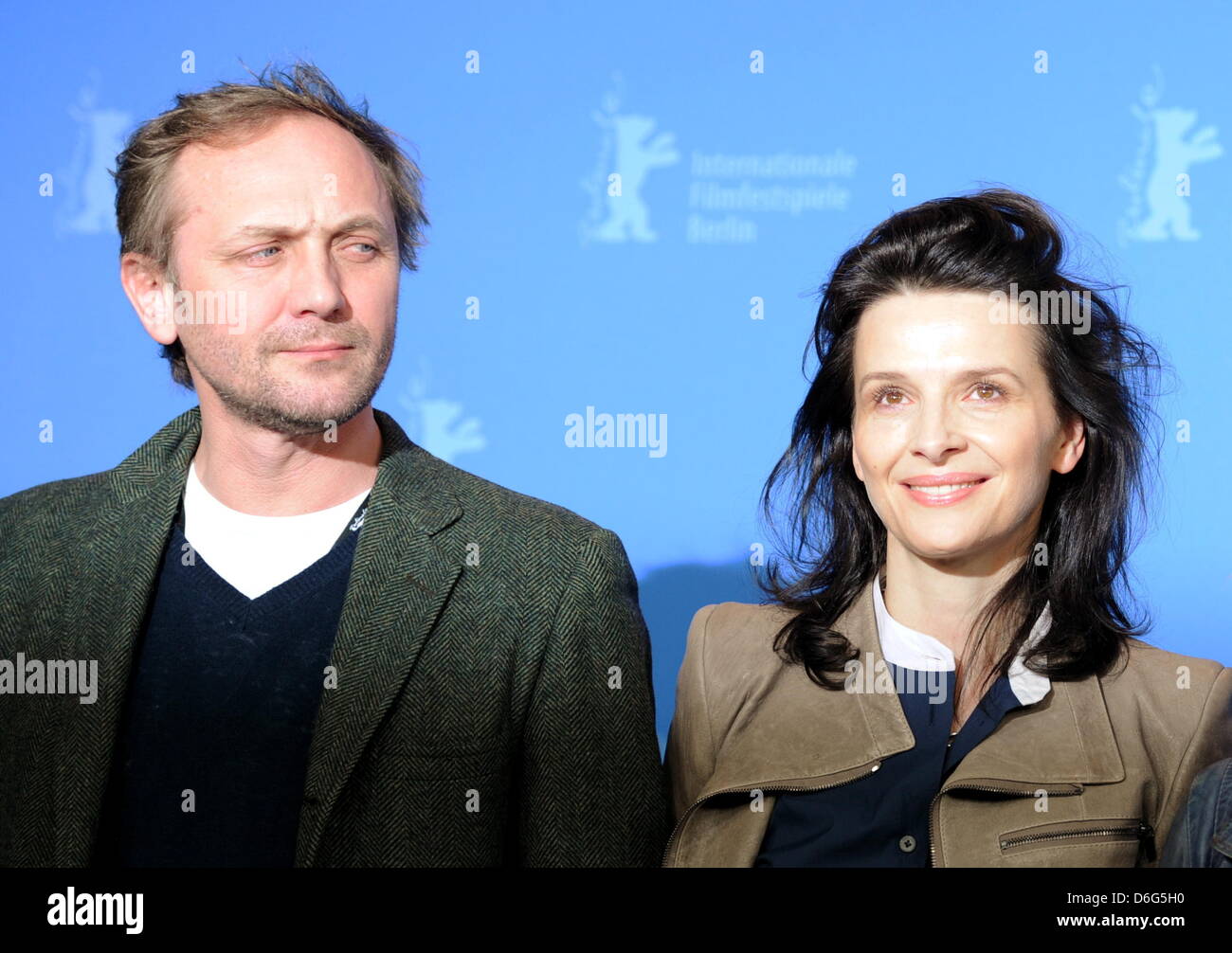 Polish actor Andrzej Chyra (L) and French actress Juliette Binoche poses at a photocall for the movie  Elles  during the 62nd Berlin International Film Festival, in Berlin, Germany, 10 February 2012. The movie is presented in the section Panorama Special at the 62nd Berlinale running from 09 to 19 February. Photo: Angelika Warmuth dpa  +++(c) dpa - Bildfunk+++ Stock Photo