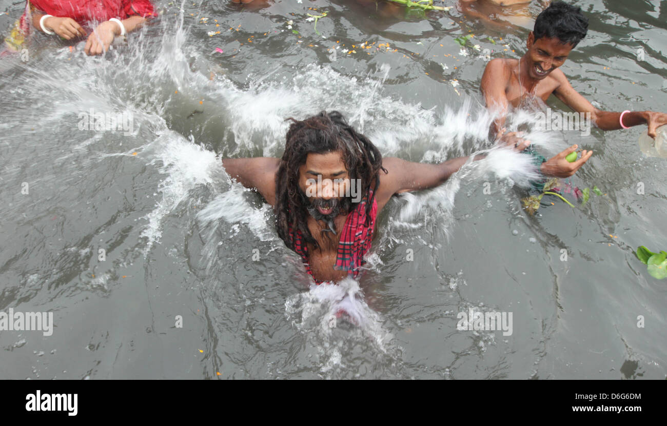 Narayangonj, Bangladesh. April 18, 2013. An elderly Bangladeshi Hindu  Shadhu devotee taking a dip bath in the Old Brahmaputra river near the port  town of Narayangang, 18 April 2013. Thousands of Hindu
