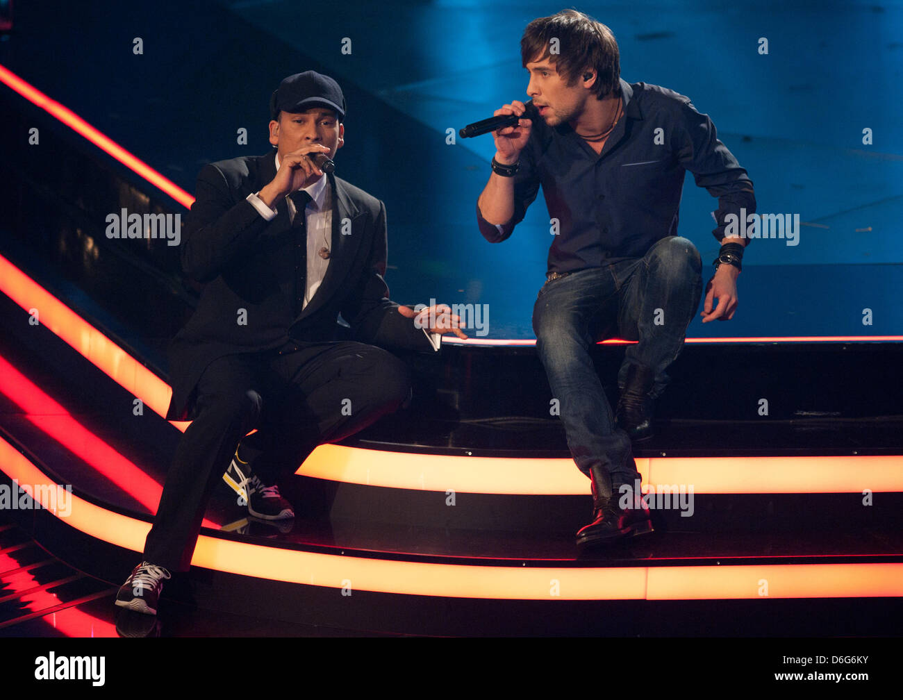 Max Giesinger (R) performs on the stage with Xavier Naidoo during the