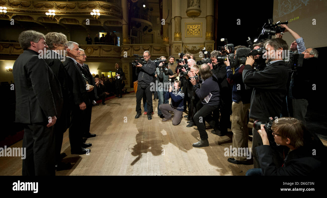 American documentary photographer James Nachtwey (3-L) poses during the award ceremony for the 3rd international peace prize, the Dresden Prize, with commercial director of the Saxon State Opera Wolfgang Rothe (L), German director Wim Wenders (2-L) and former Interior Minister Gerhart Baum (4-L) at the Semper Opera in Dresden, Germany, 11 February 2012. The prize worth 25,000 euros Stock Photo