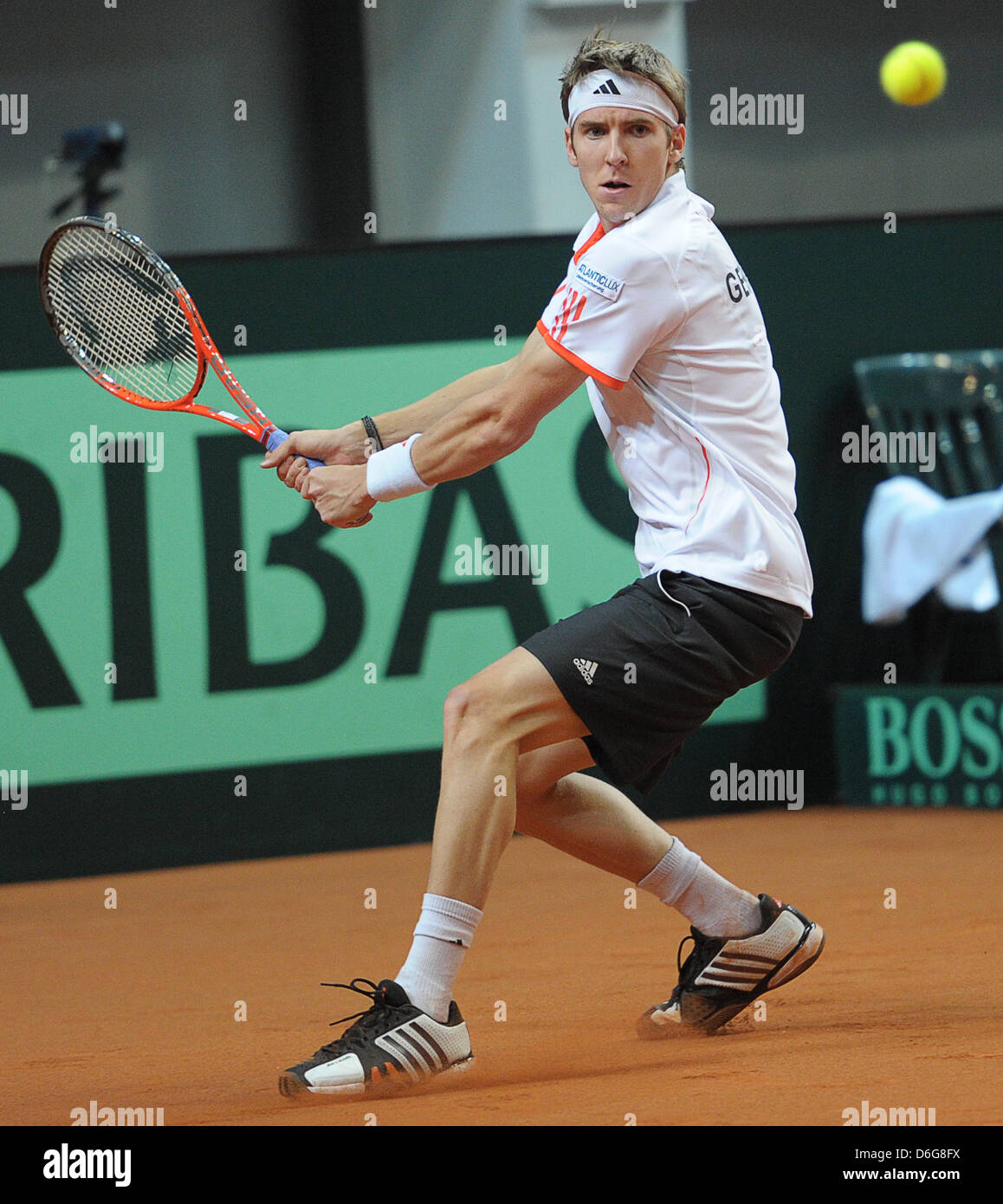 German tennis player Cedrik-Marcel Stebe plays the ball during the Davis  Cup tennis match against Argentina's Schwank at Stechert Arena in Bamberg,  Germany, 12 February 2012. From 10 to 12 February, the
