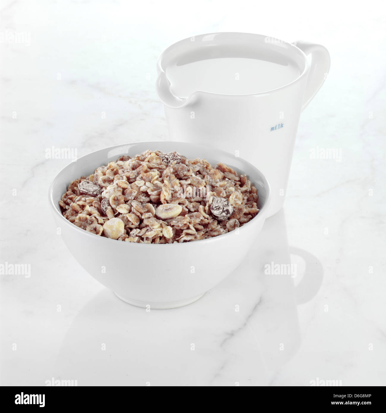 Muesli with a Jug of Milk Stock Photo Alamy