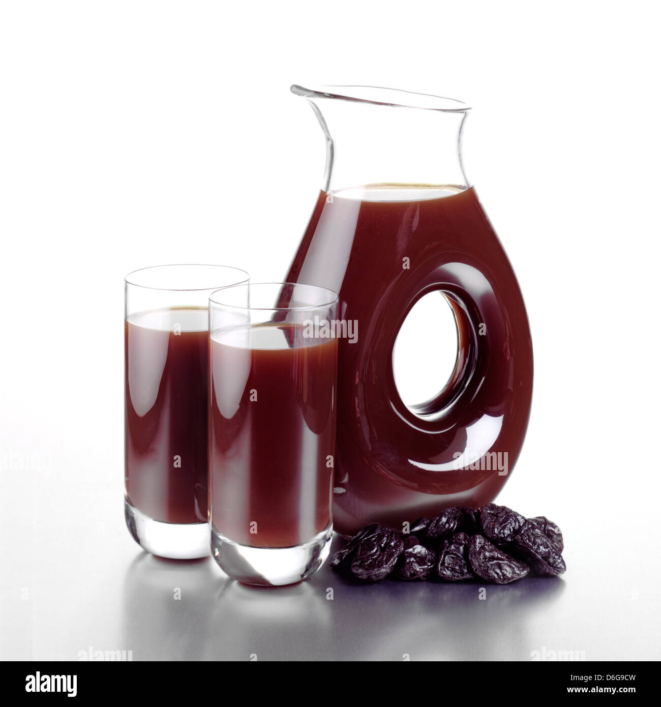 Jug of Prune Juice, Two Full Glasses and Dried Prunes Stock Photo Alamy