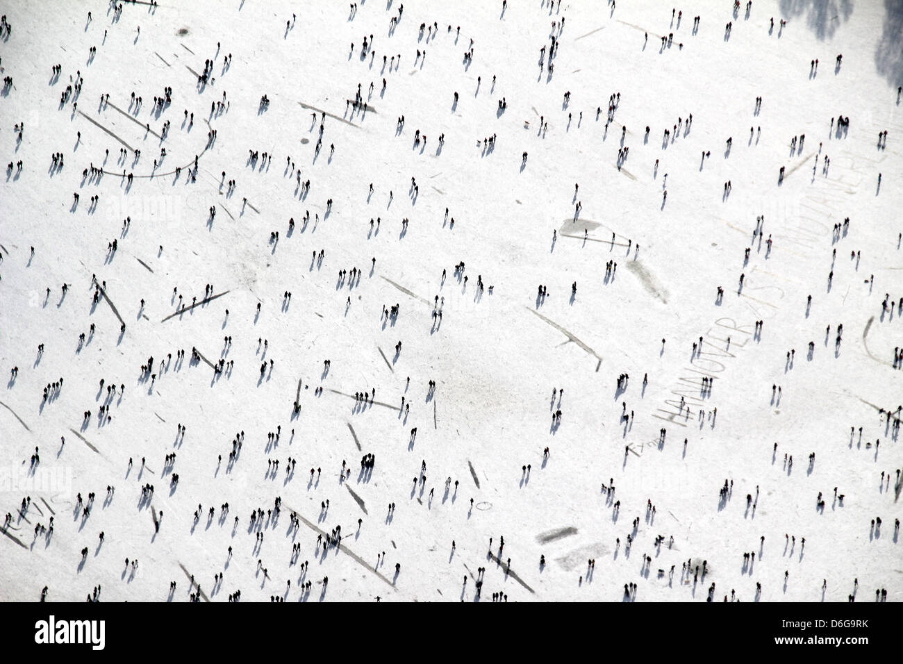 Thousands of people gather at the frozen Masch Lake in Hanover, Germany, 11 February 2012. A 13cm thick layer of ice carries all these people easily. Photo: Stefan Rampfel Stock Photo