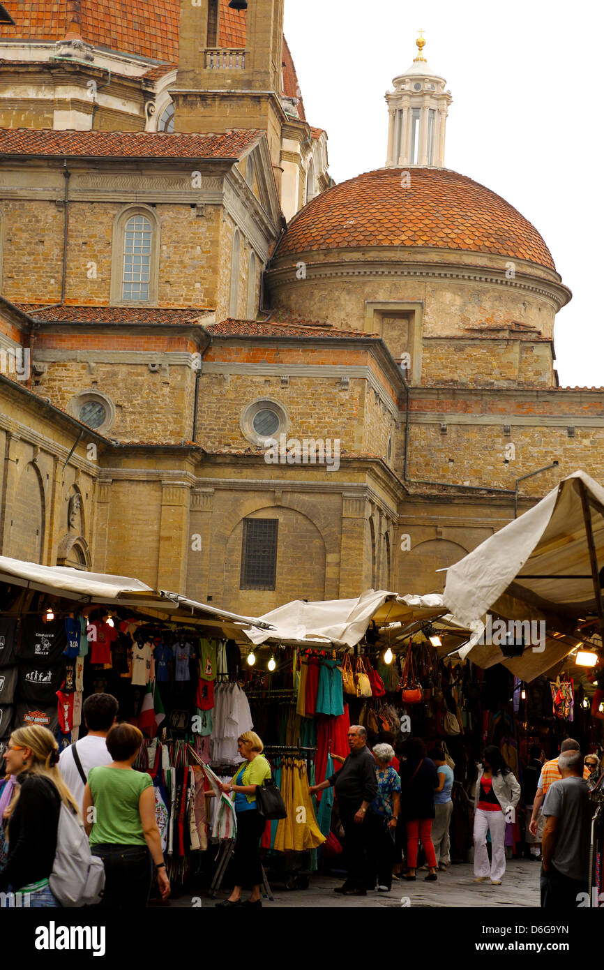 The San Lorenzo market alongside the Basilica di San Lorenzo and Medicee Chapel in Florence Italy Stock Photo
