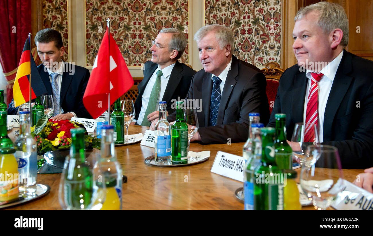 Head of department of European policy at the Bavarian state chancellery, Joerg Vogel (L-R), German ambassador to Switzerland, Klaus-Peter-Gottwald, Bavarian Premier Horst Seehofer and chairman of the Free Democratic Party of the Bavarian parliament, Thomas Hacker are greeted by the President of the Council of States of the Swiss Confederation, Hans Altherr (not in picture) at the F Stock Photo