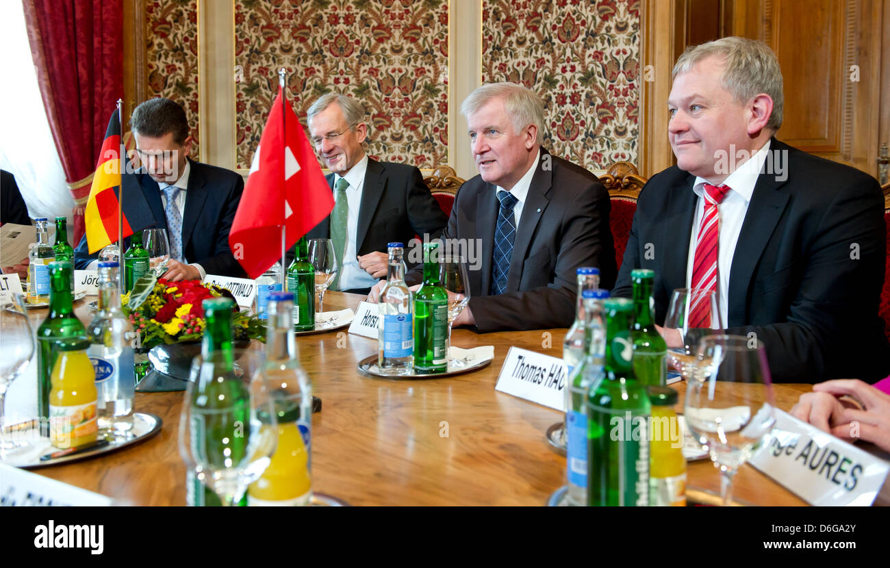 Head of department of European policy at the Bavarian state chancellery, Joerg Vogel (L-R), German ambassador to Switzerland, Klaus-Peter-Gottwald, Bavarian Premier Horst Seehofer and chairman of the Free Democratic Party of the Bavarian parliament, Thomas Hacker are greeted by the President of the Council of States of the Swiss Confederation, Hans Altherr (not in picture) at the F Stock Photo
