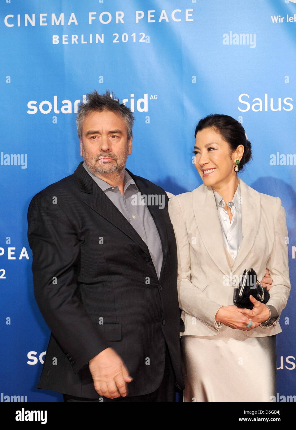 French director Luc Besson and Malay actress Michelle Yeoh arrive for