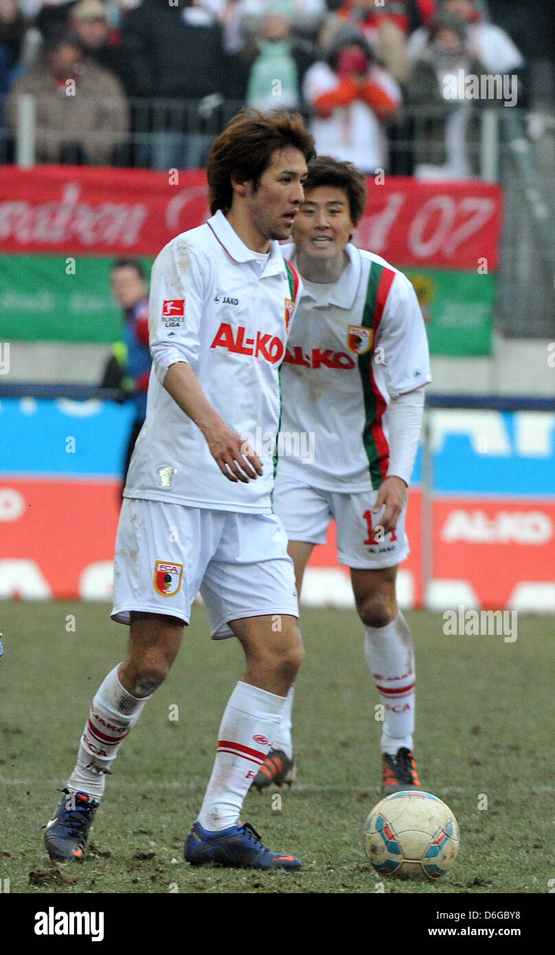 Augsburg's two Asian players Hajime Hosogai from Japan (L) and Ja-Cheol Koo from South Korea are pictured during the Bundesliga soccer match between FC Augsburg and FC Nuremberg at the SGL Arena in Augsburg, Germany, 12 February 2012. The match ended 0-0 undecided. Photo: Stefan Puchner Stock Photo