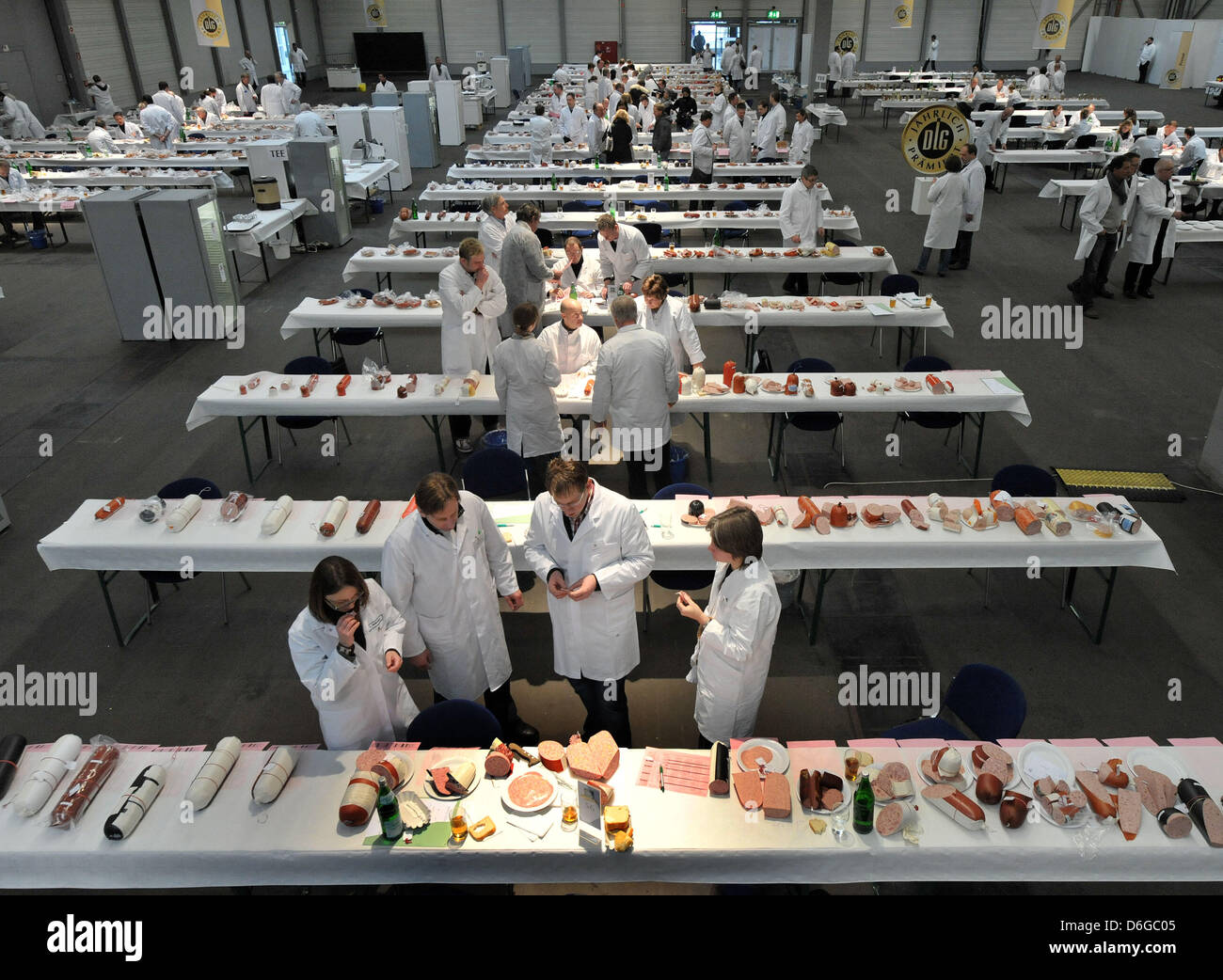 Testers evaluate various products during a quality test of ham and ...