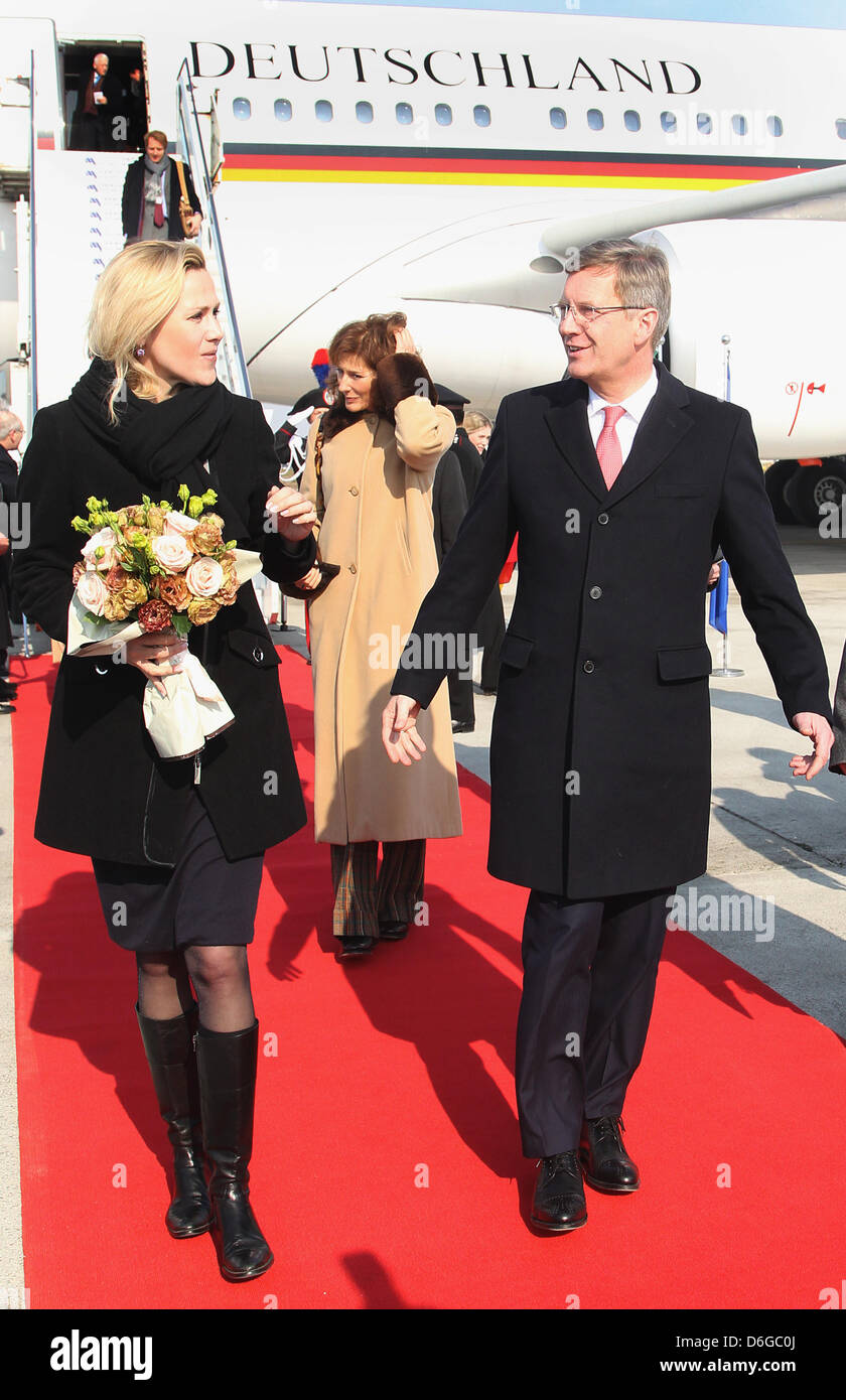 German President Christian Wulff And His Wife Bettina (L) Walk Next To