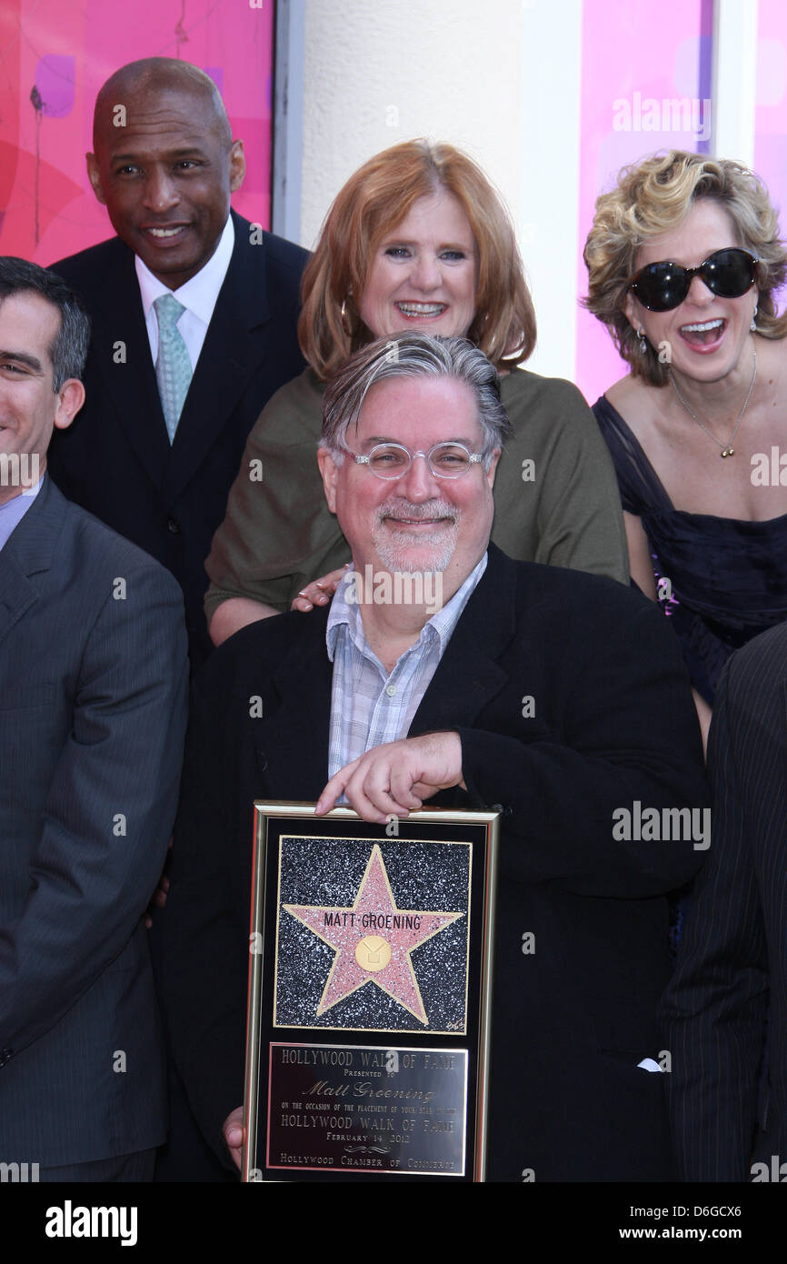 Creator of tv show The Simpsons, Matt Groening (center, with glasses) and guests attend the ceremony honorong Groening with a new star on the Hollywood Walk Of Fame on Hollywood Boulevard in Los Angeles, USA, on 14 February 2012. Photo: Hubert Boesl Stock Photo