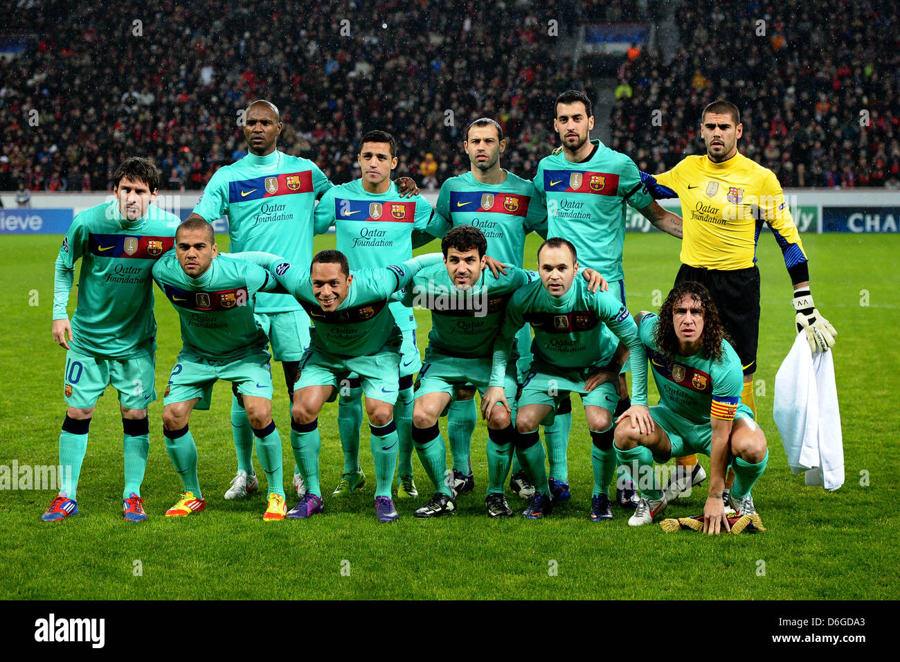 The team of FC Barcelona (back L-R) Éric Abidal, Adriano Correia, Javier Mascherano, Sergio Busquets, goalkeeper Víctor Valdés (front L-R) Lionel Messi, Daniel Alves, Alexis Sanchez, Cesc Fabregas, Andres Iniesta, Carles Puyol are pictured prior to the UEFA Champions League match between Bayer Leverkusen and FC Barcelona at the BayArena in Leverkusen, Germany, 14 February 2012. Pho Stock Photo