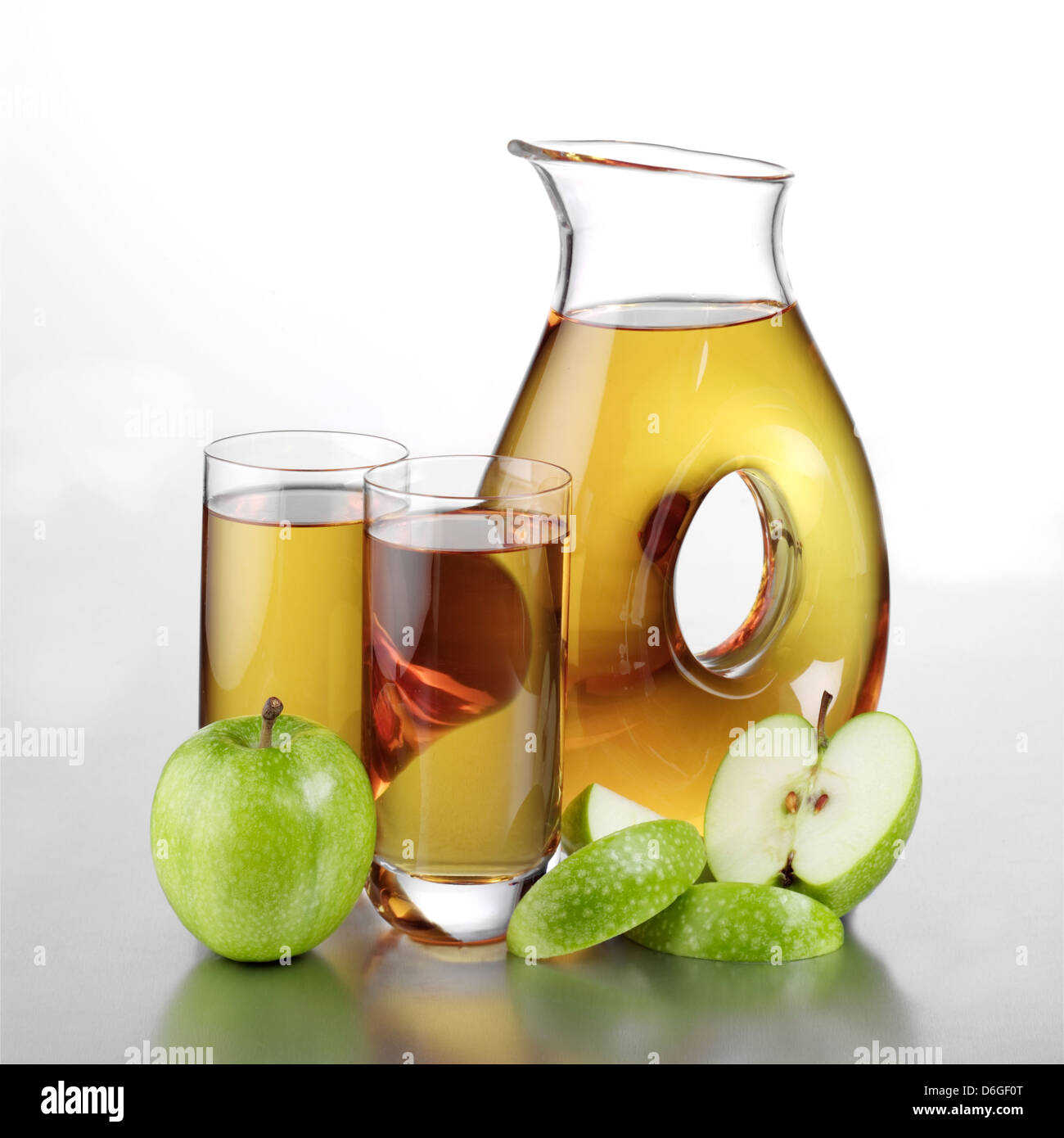 Jug of Apple Juice, Two Full Glasses and Sliced Apple Stock Photo Alamy