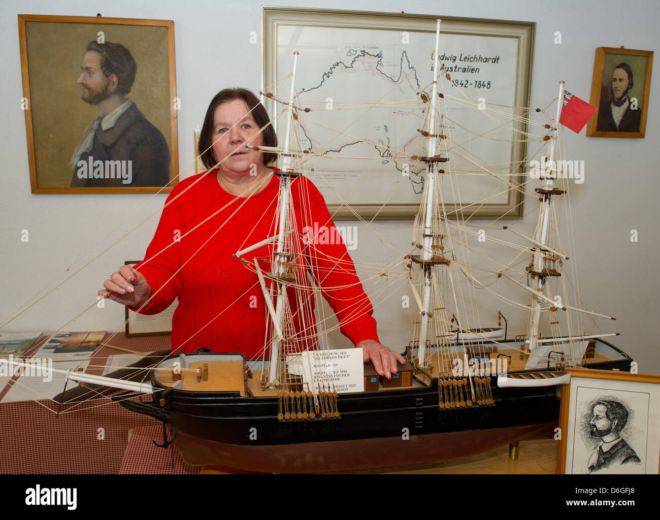 Museum employee Sabine Miething stands behind a model of the ship that researcher Leichhardt traveled to Australia with in 1841 in the Ludwig-Leichhardt-Museum in Trebatsch, Germany, 16 February 2012. A exhibition to commemorate the 200th birthday of Ludwig Leichhardt, born in Trebatsch in 1813 and a pioneer in the Australian outback, will take place in 2013. The exhibition is mean Stock Photo