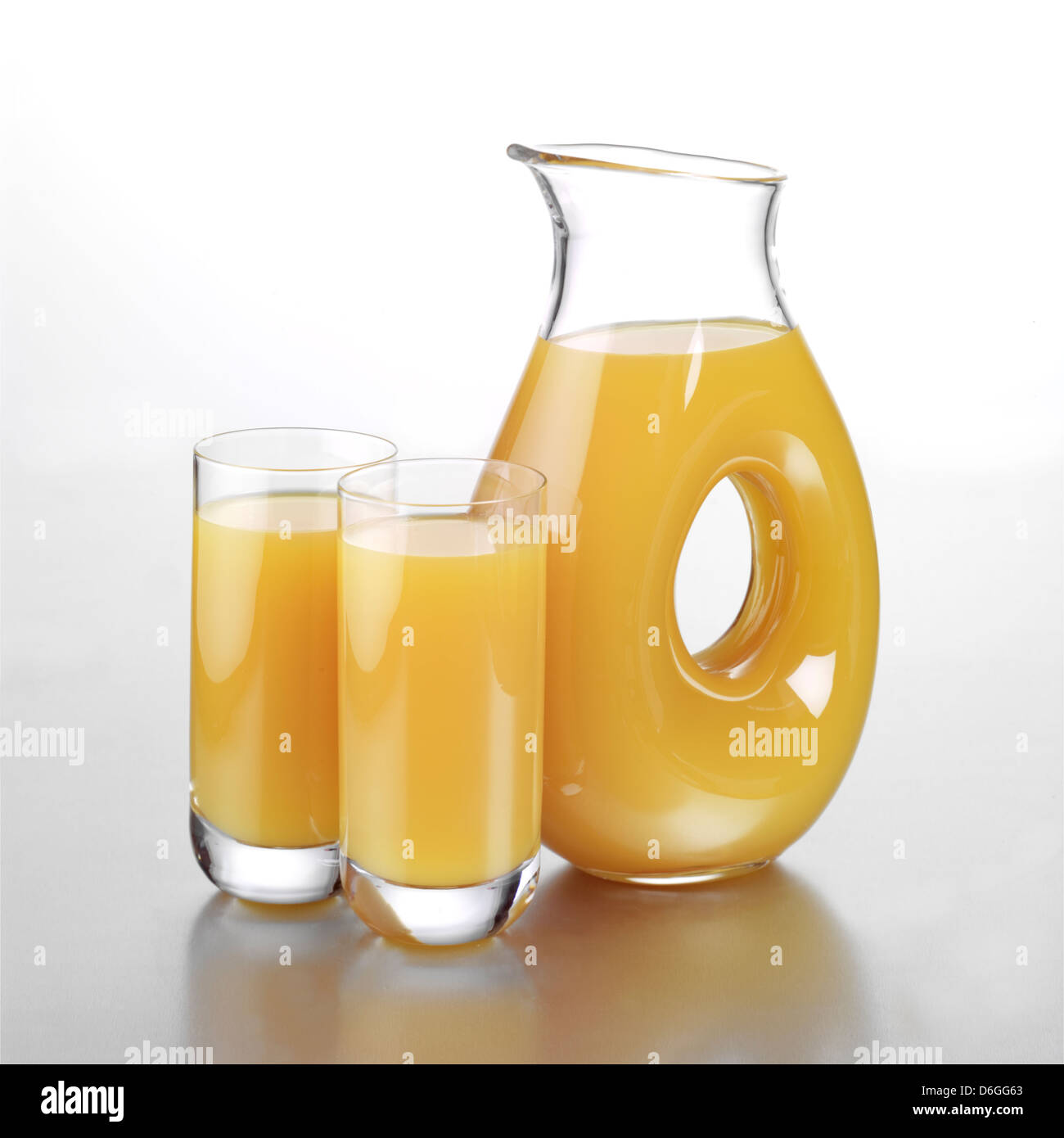 Jug of Mango and Orange Juice with Two Full Glasses Stock Photo - Alamy
