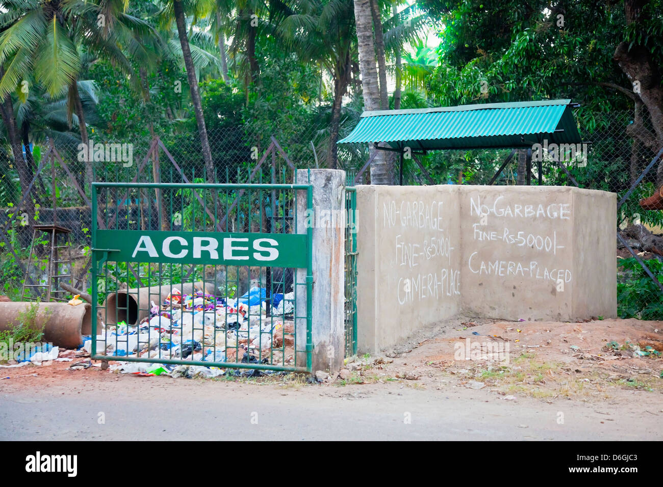 Horizontal landscape of a scene in Goa, India. Typifies a cultural attitude towards littering in urban and rural areas. Stock Photo