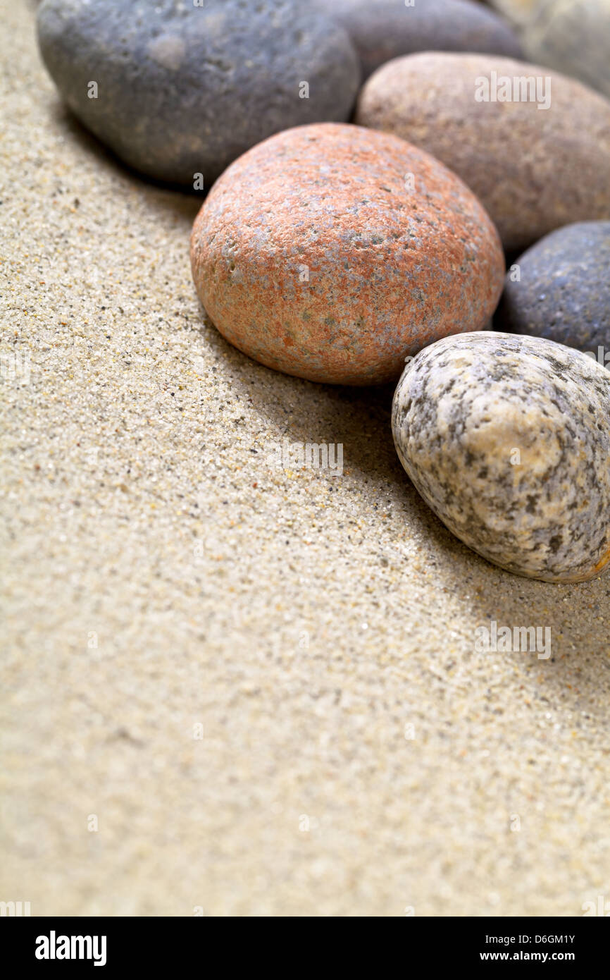 Premium Photo  A close up of a sand with small rocks and pebbles